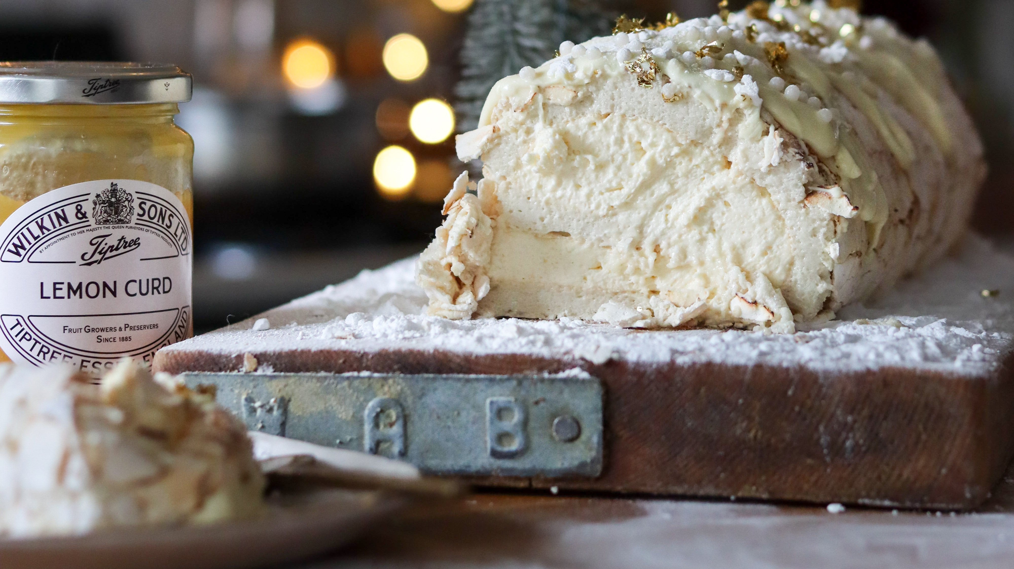 Lemon Curd & White Chocolate Yule-ade Roulade by The Boho Baker