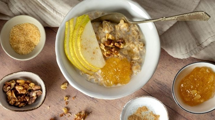 A bowl of fresh Ginger Porridge with Pear and Walnuts