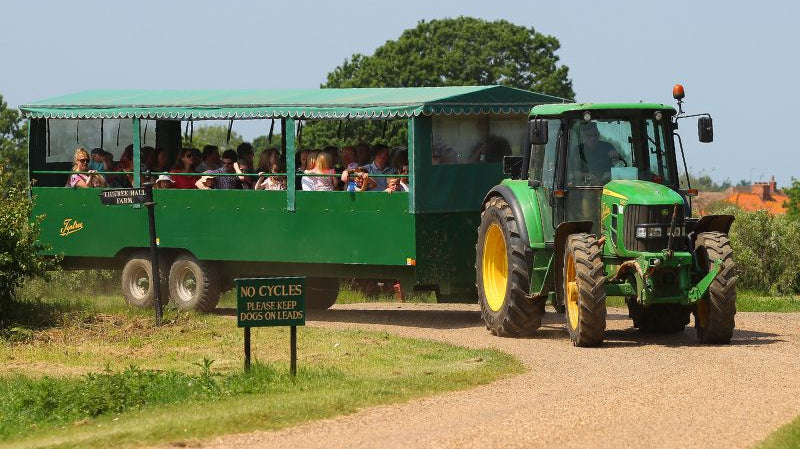 Tractor with trailer touring the Tiptree farm