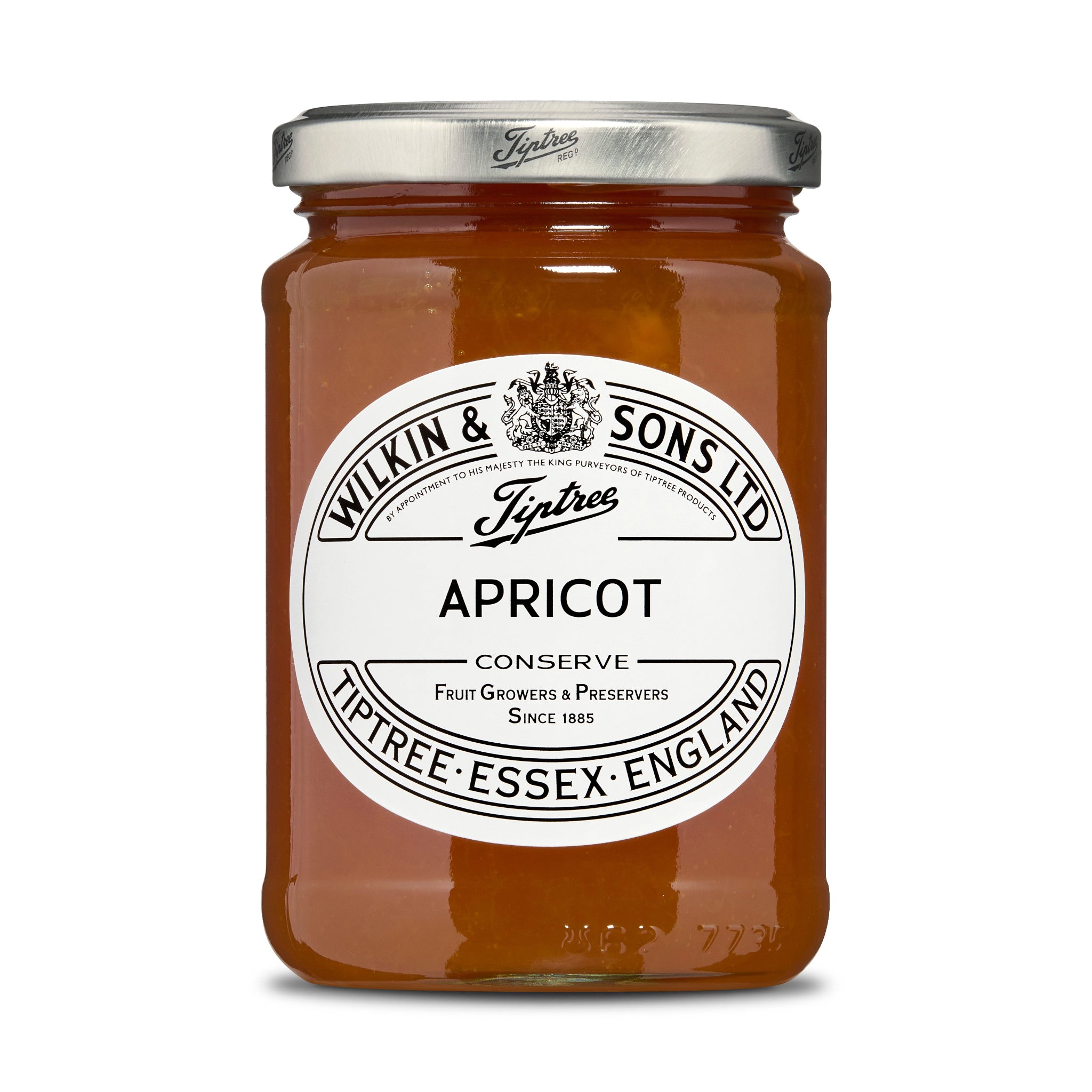 Jar of apricot conserve with a white label on a white background