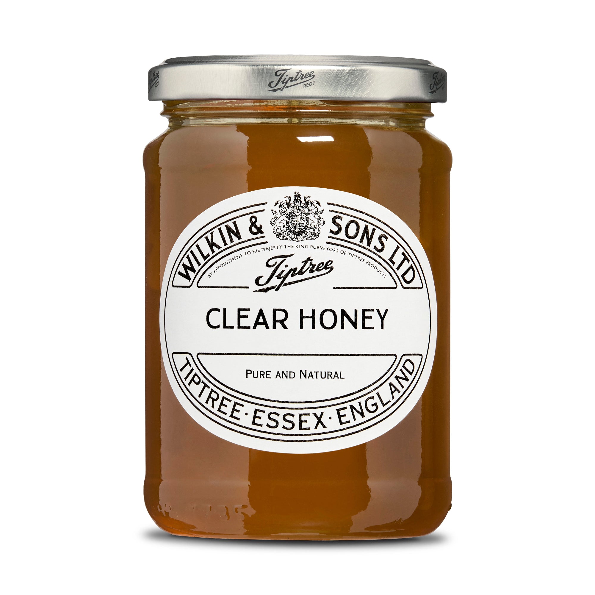 Jar of Tiptree clear honey with a white label on a white background