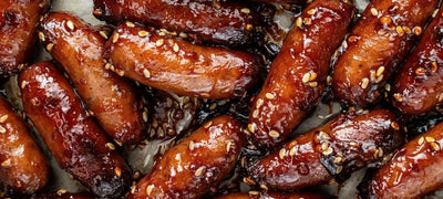 Sticky Damson and Sesame Sausages