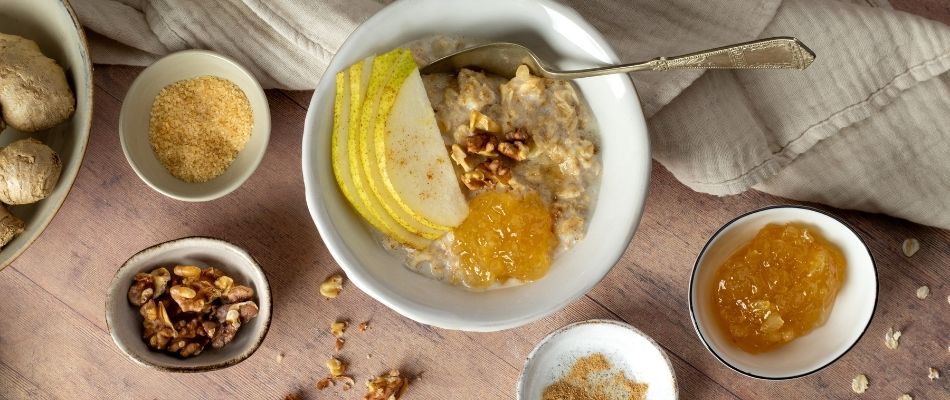 A bowl of fresh Ginger Porridge with Pear and Walnuts