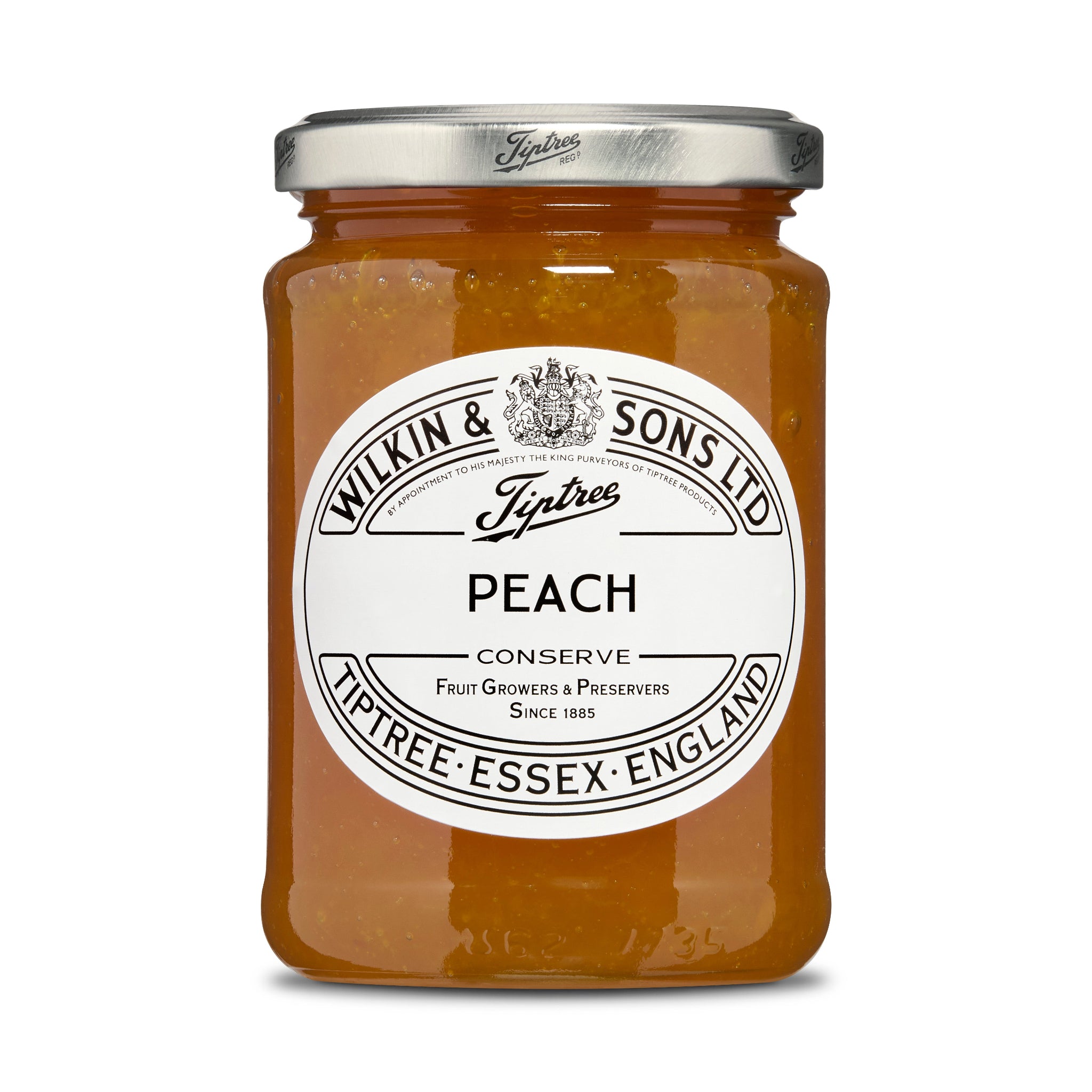 Jar of Tiptree peach conserve with a white label on a white background