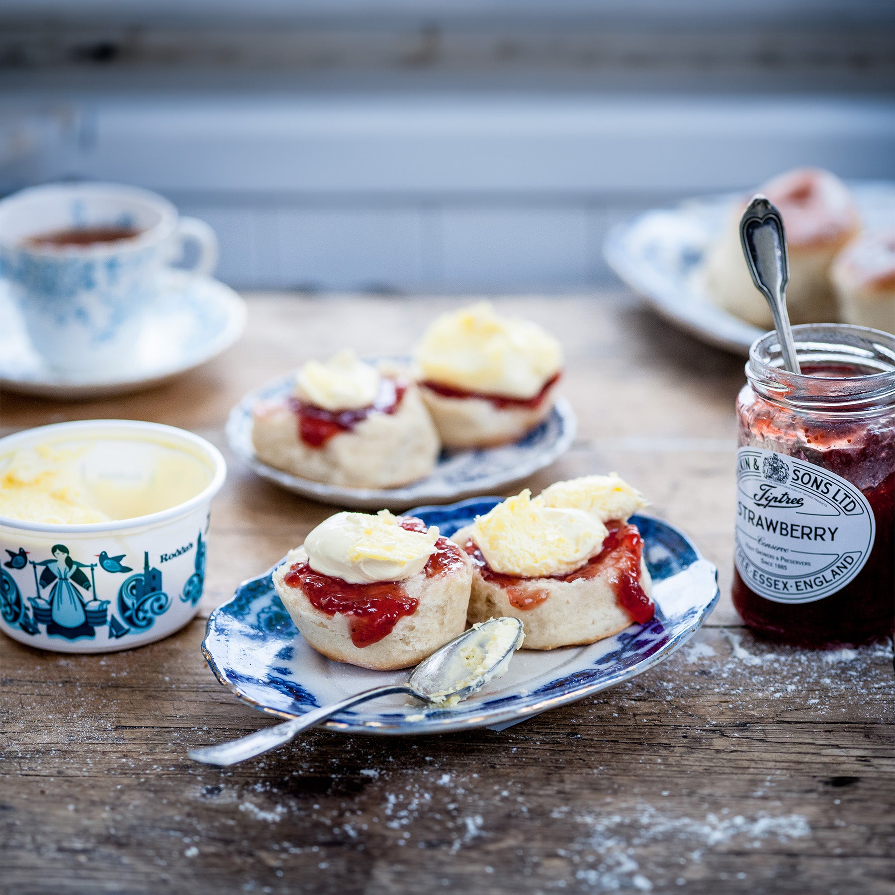 A classic cream tea, a scone with Strawberry jam and clotted cream.