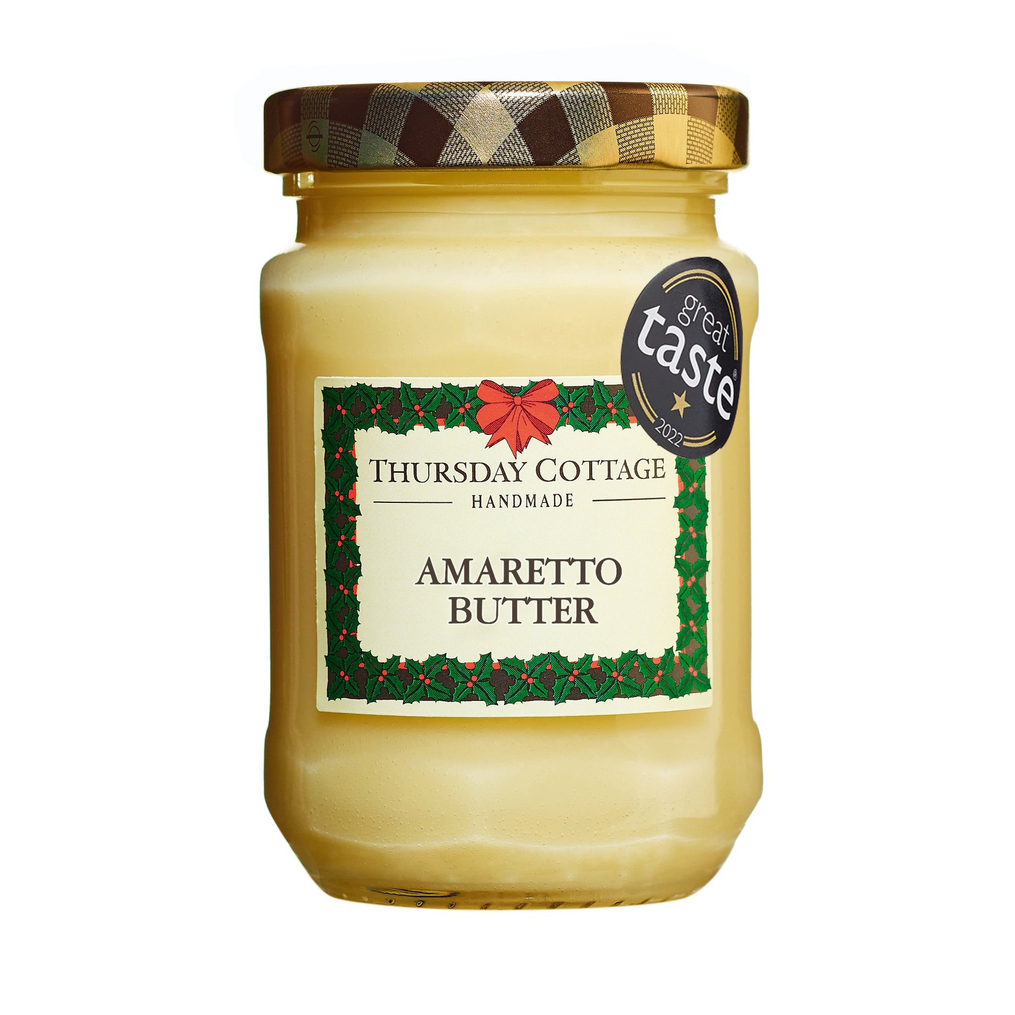 A jar of Thursday Cottage Amaretto Butter with a Christmas-themed label, indicating that it is a creamy dessert spread with amaretto flavor.