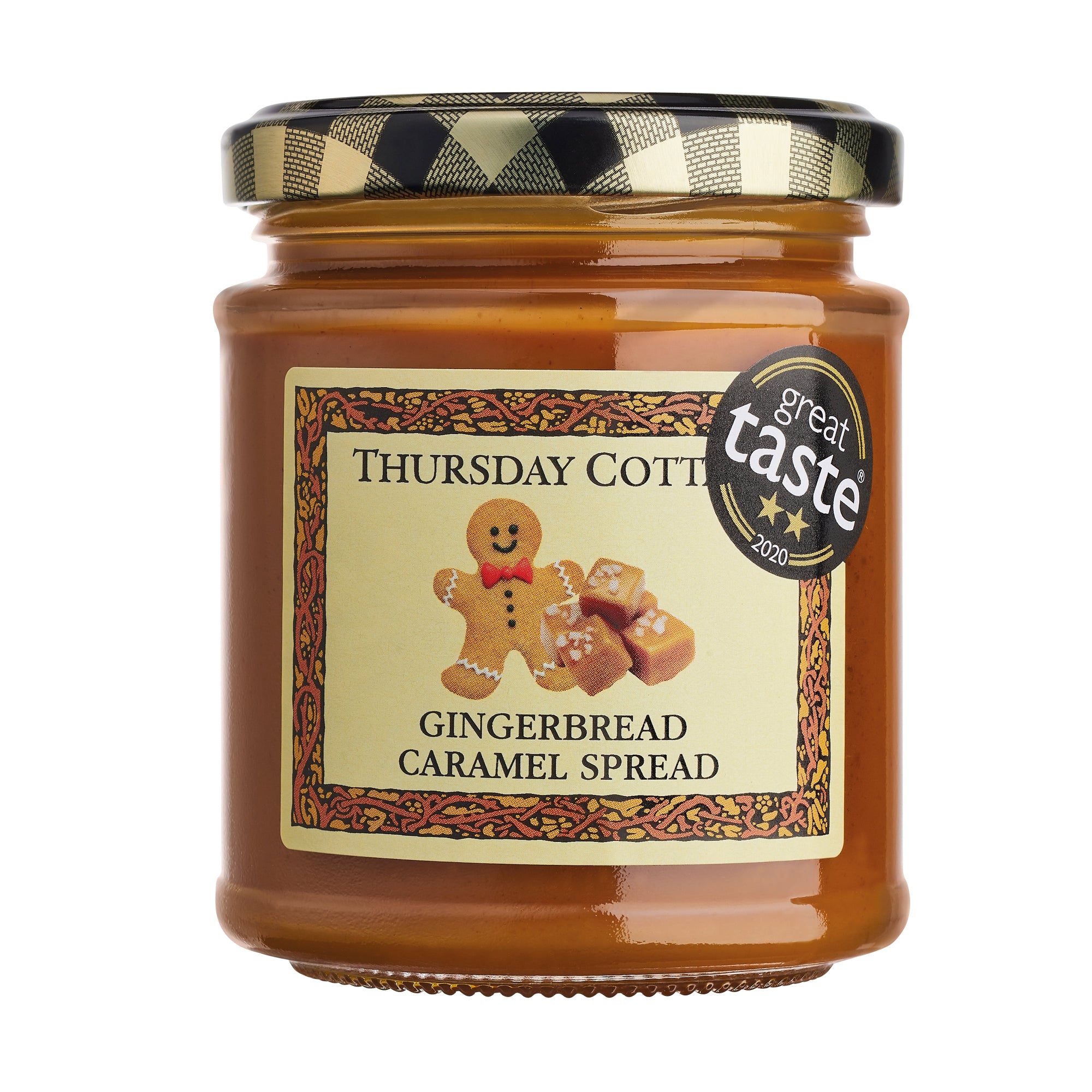 A jar of Thursday Cottage Gingerbread Caramel Spread with a label showing a gingerbread man and the award badge for Great Taste.
